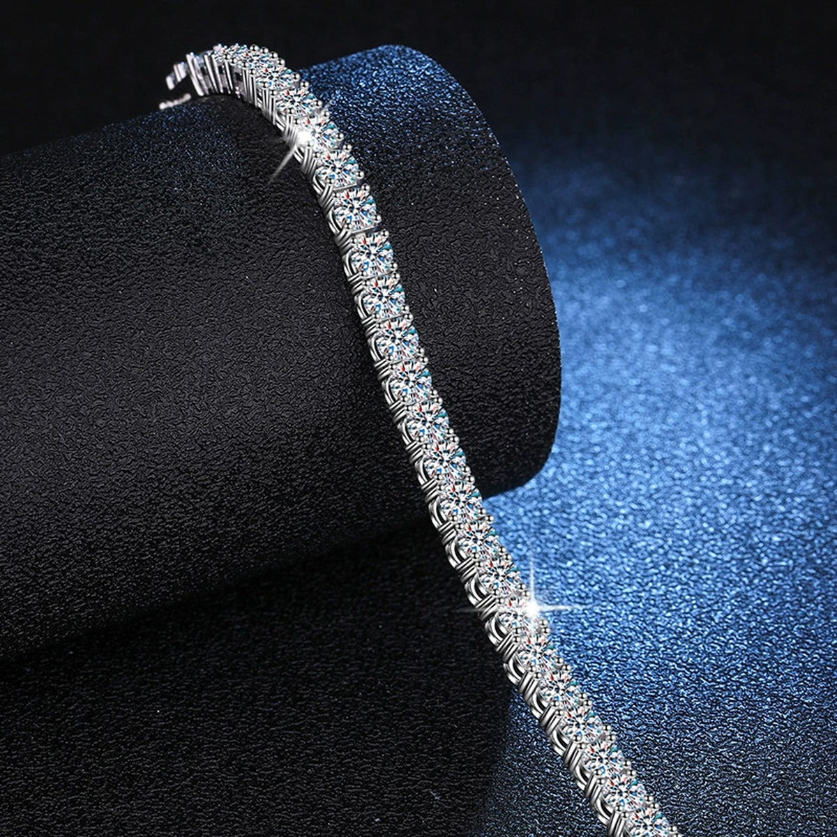 Moissanite Tennis Bracelet in White Gold-Plated S925 Sterling Silver blue display scene showing bracelet sparkle and chain detail