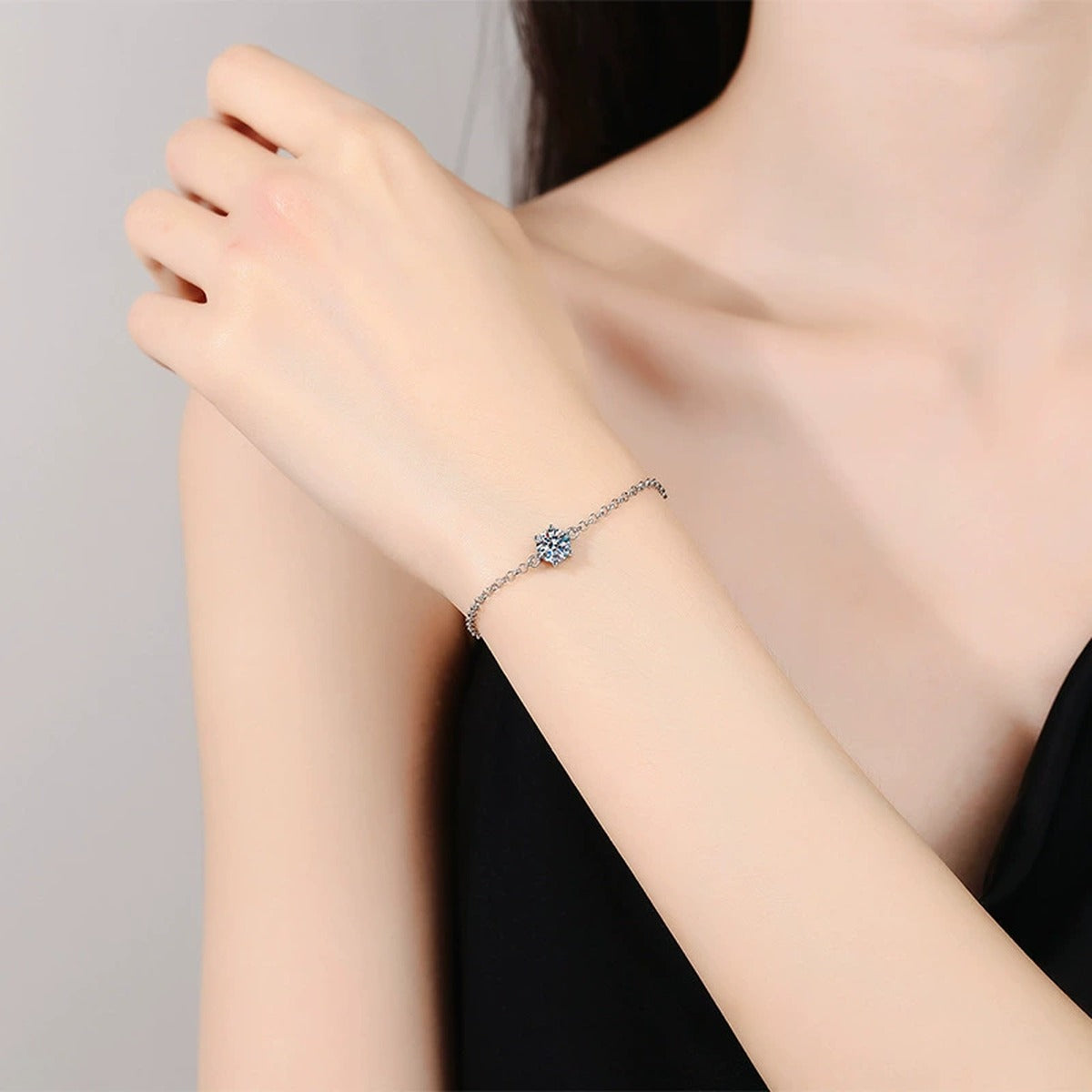 Starburst Moissanite Chain Bracelet in White Gold-Plated S925 Sterling Silver worn on wrist model view showing scale and fit
