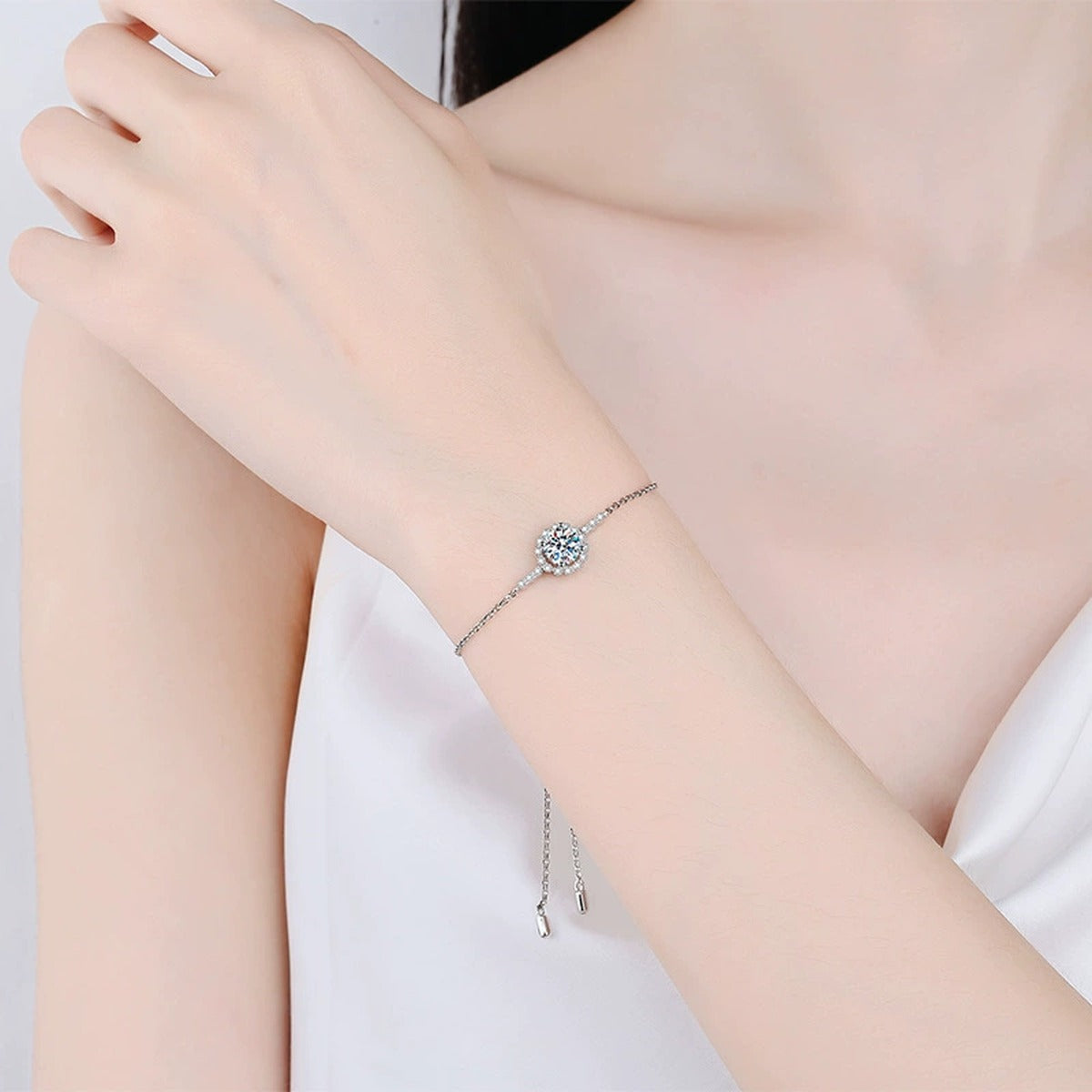 Round Halo Moissanite Adjustable Chain Bracelet with CZ in White Gold-Plated S925 Sterling Silver worn on wrist model view showing scale and fit