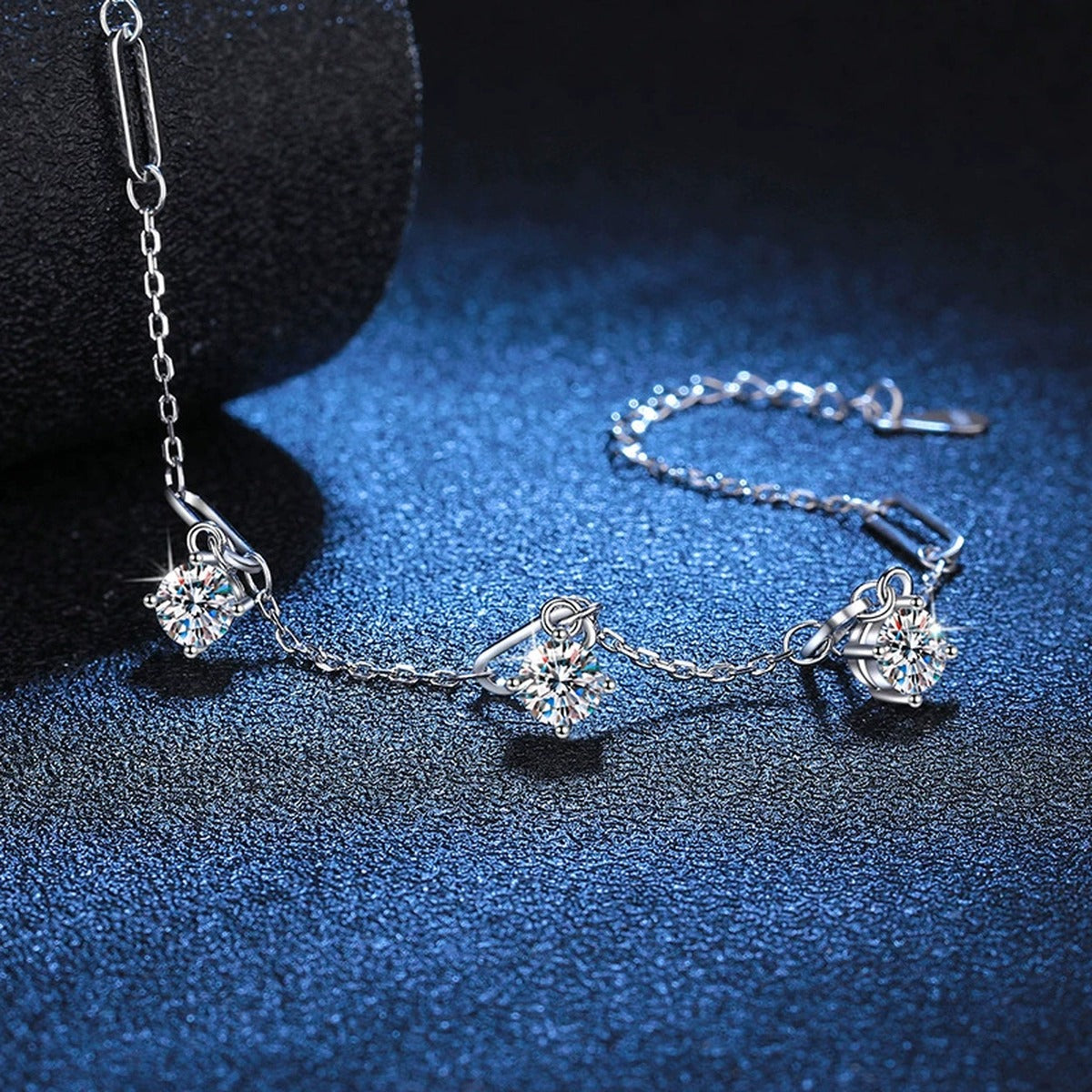 Multi-Charm Moissanite Chain Bracelet in White Gold-Plated S925 Sterling Silver blue display scene showing bracelet sparkle and chain detail