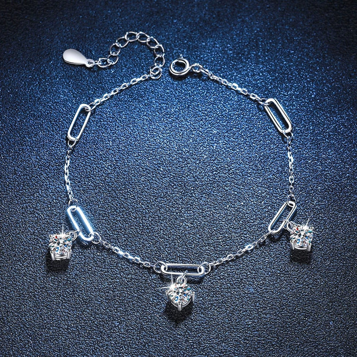Multi-Charm Moissanite Chain Bracelet in White Gold-Plated S925 Sterling Silver blue display scene showing bracelet sparkle and chain detail