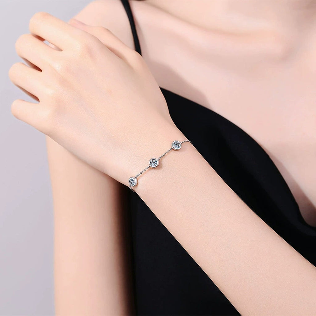 Three-Stone Moissanite Adjustable Chain Bracelet in White Gold-Plated S925 Sterling Silver worn on wrist model view showing scale and fit