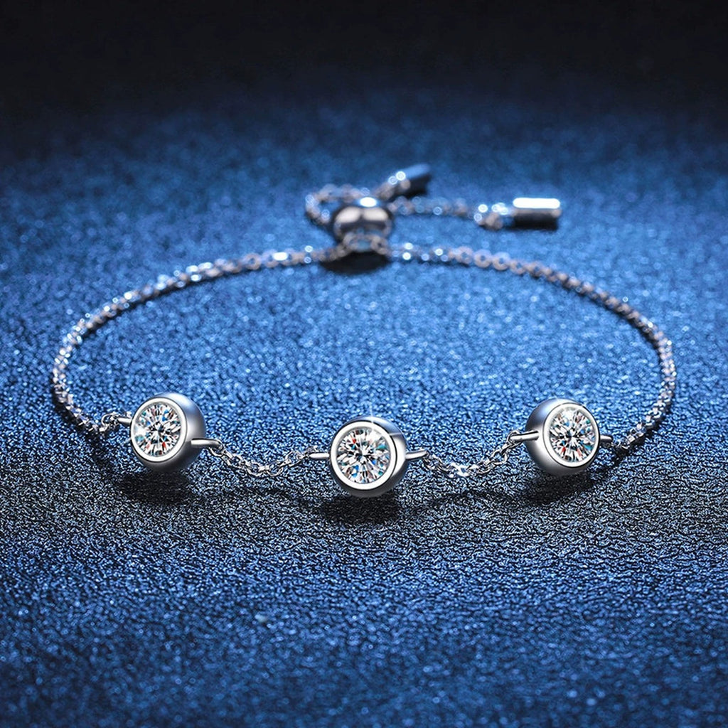 Three-Stone Moissanite Adjustable Chain Bracelet in White Gold-Plated S925 Sterling Silver blue display scene showing bracelet sparkle and chain detail