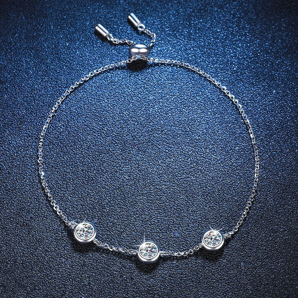 Three-Stone Moissanite Adjustable Chain Bracelet in White Gold-Plated S925 Sterling Silver blue display scene showing bracelet sparkle and chain detail