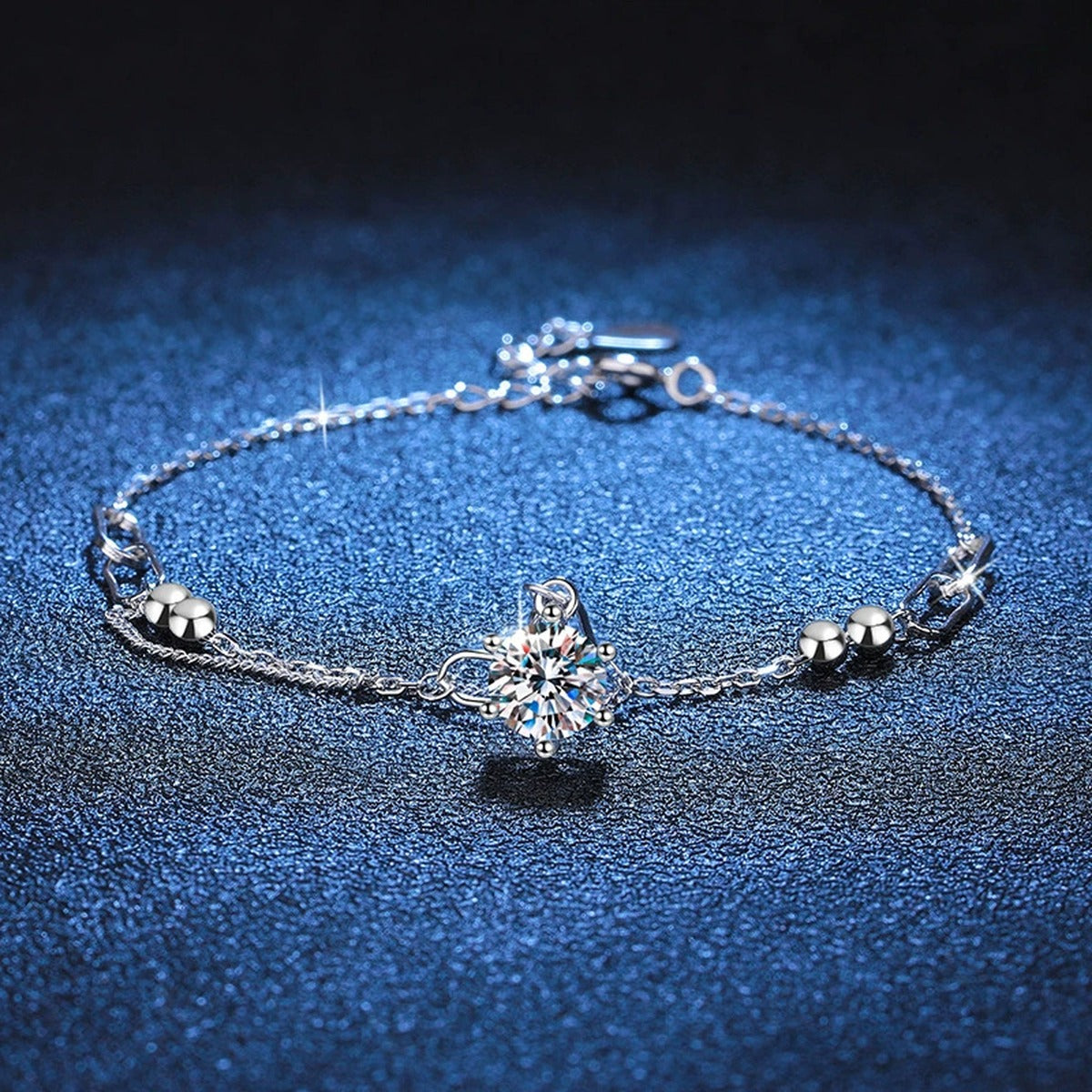 Drop Moissanite Chain Bracelet in White Gold-Plated S925 Sterling Silver blue display scene showing bracelet sparkle and chain detail