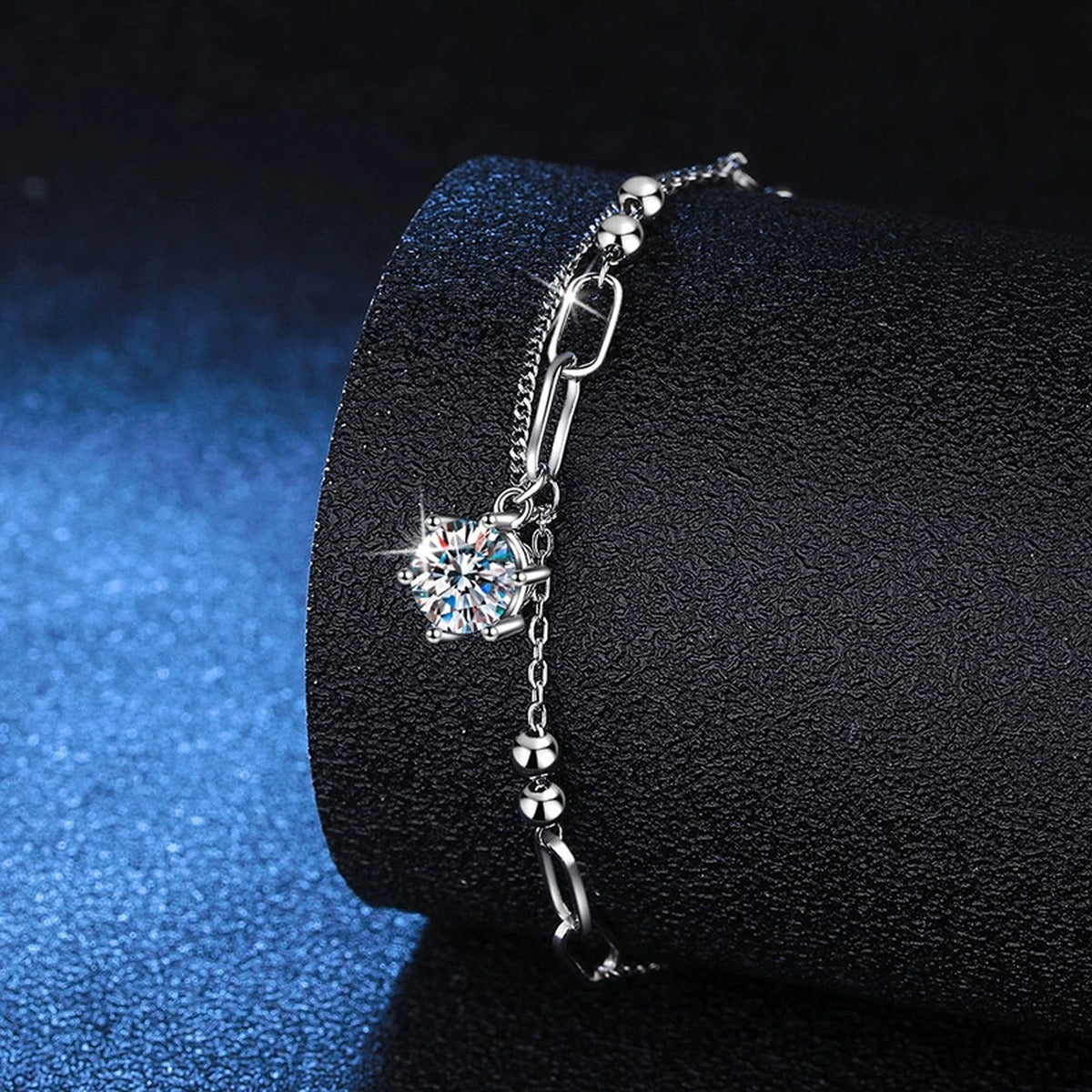 Drop Moissanite Chain Bracelet in White Gold-Plated S925 Sterling Silver blue display scene showing bracelet sparkle and chain detail