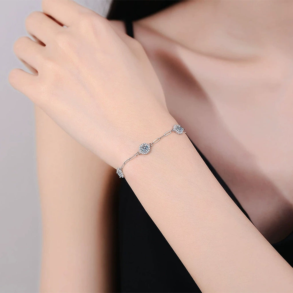 Three-Stone Round Moissanite Chain Bracelet with CZ in White Gold-Plated S925 Sterling Silver worn on wrist model view showing scale and fit