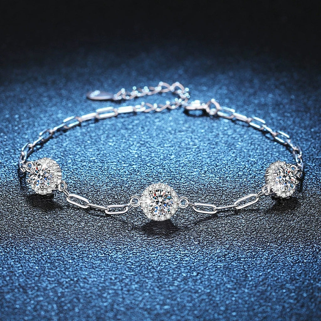 Three-Stone Round Moissanite Chain Bracelet with CZ in White Gold-Plated S925 Sterling Silver blue display scene showing bracelet sparkle and chain detail