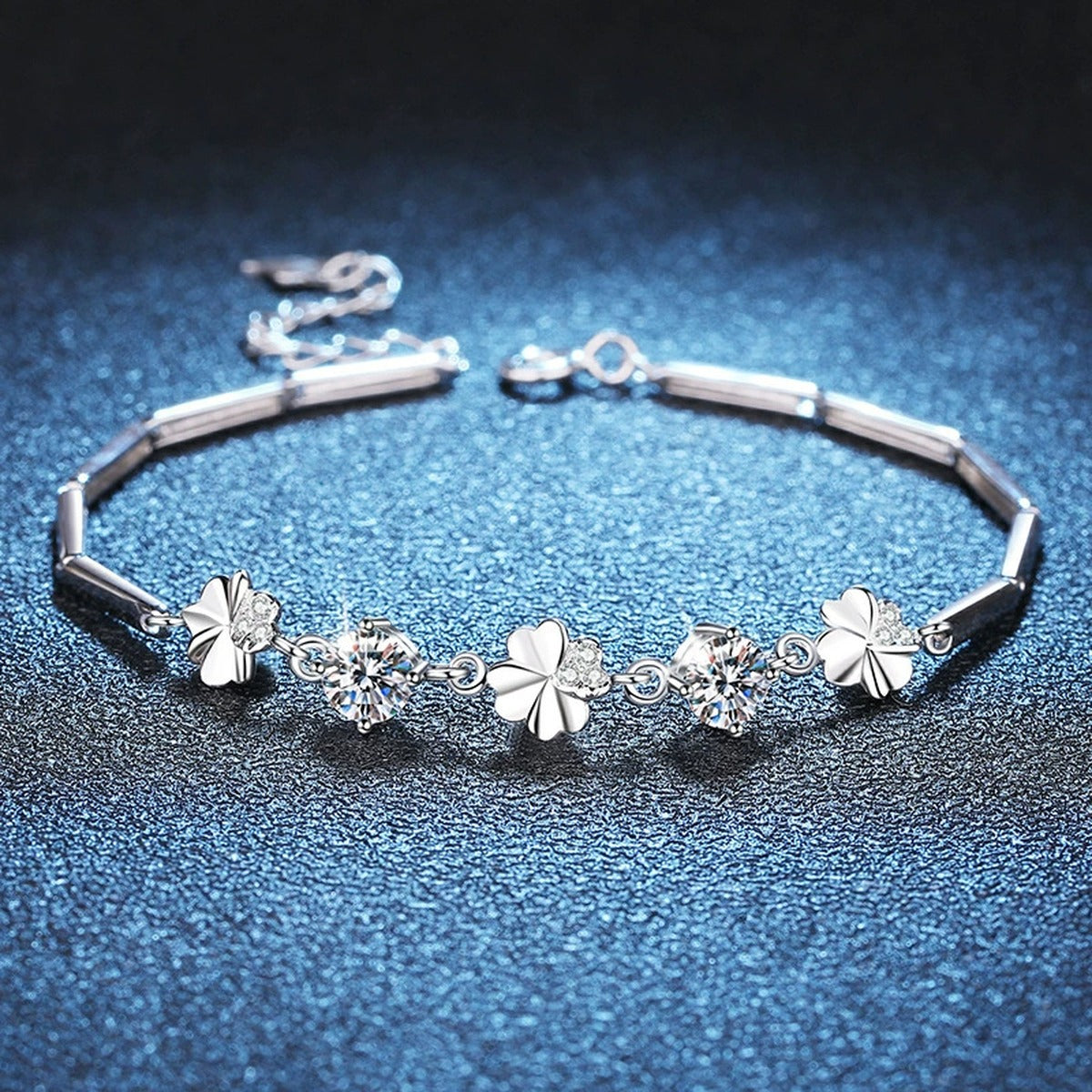 Graduated Moissanite Chain Bracelet with CZ in White Gold-Plated S925 Sterling Silver blue display scene showing bracelet sparkle and chain detail