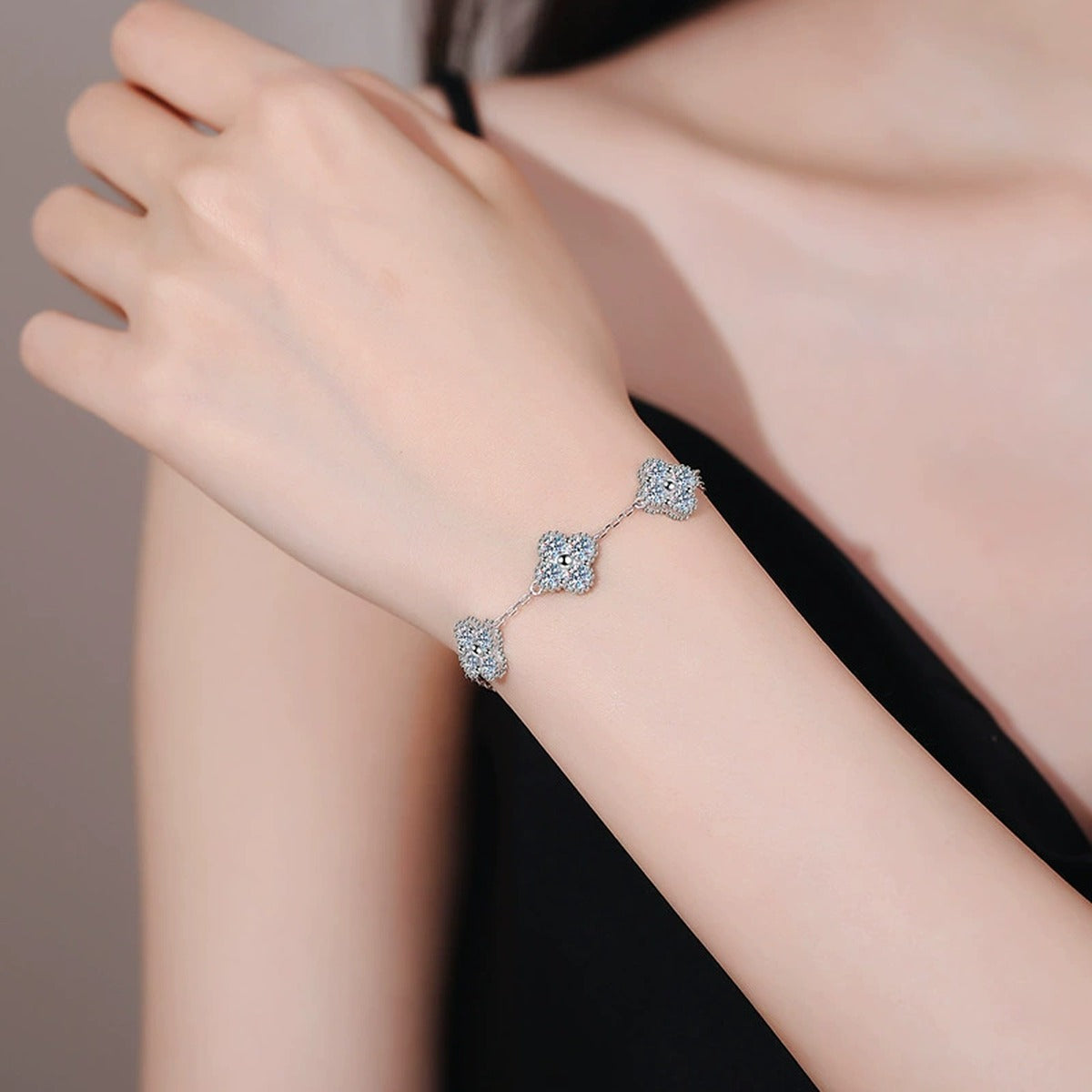 Three-Stone Cushion Moissanite Chain Bracelet in White Gold-Plated S925 Sterling Silver worn on wrist model view showing scale and fit