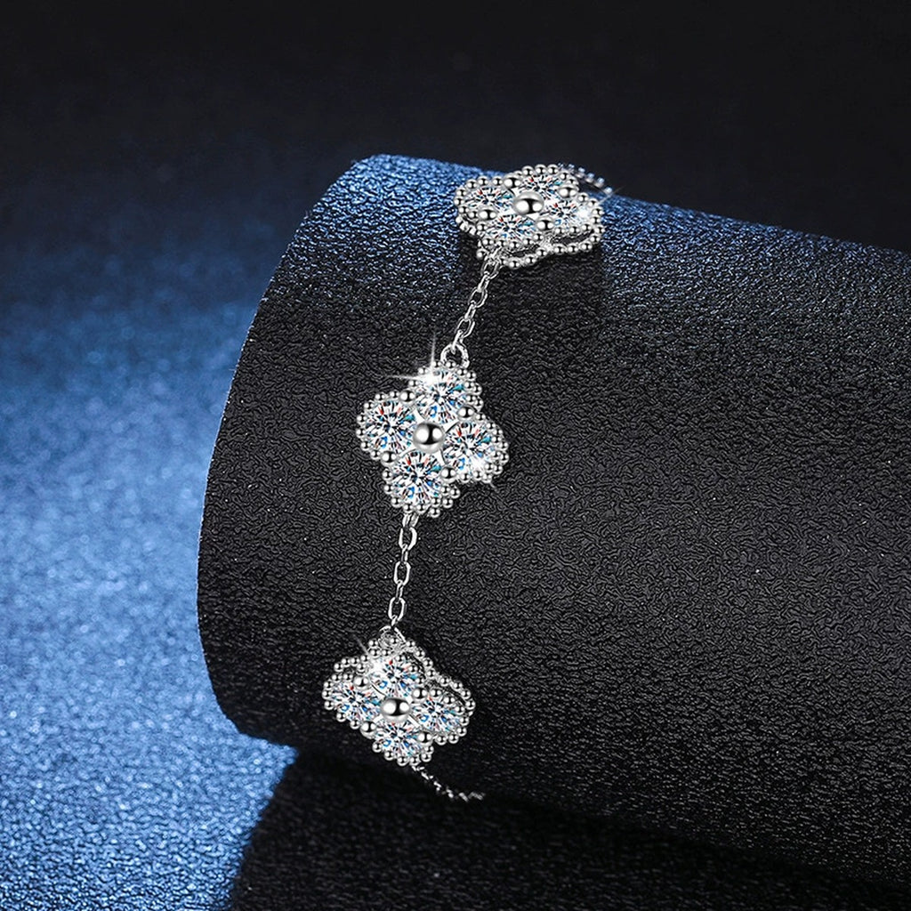Three-Stone Cushion Moissanite Chain Bracelet in White Gold-Plated S925 Sterling Silver blue display scene showing bracelet sparkle and chain detail