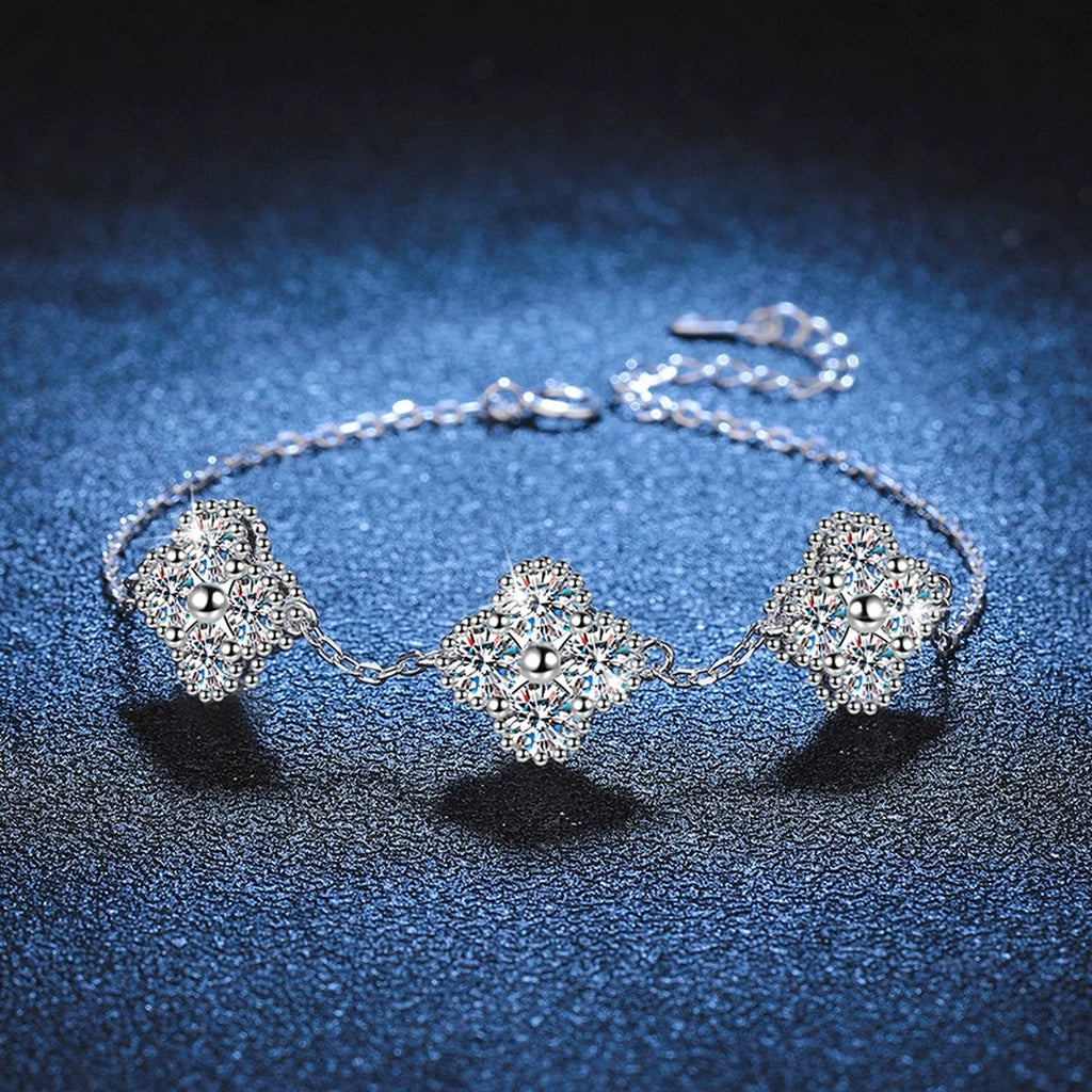 Three-Stone Cushion Moissanite Chain Bracelet in White Gold-Plated S925 Sterling Silver blue display scene showing bracelet sparkle and chain detail