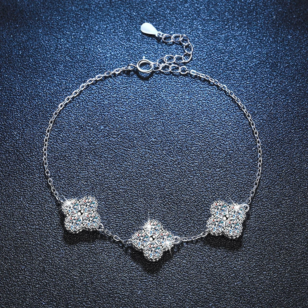 Three-Stone Cushion Moissanite Chain Bracelet in White Gold-Plated S925 Sterling Silver blue display scene showing bracelet sparkle and chain detail