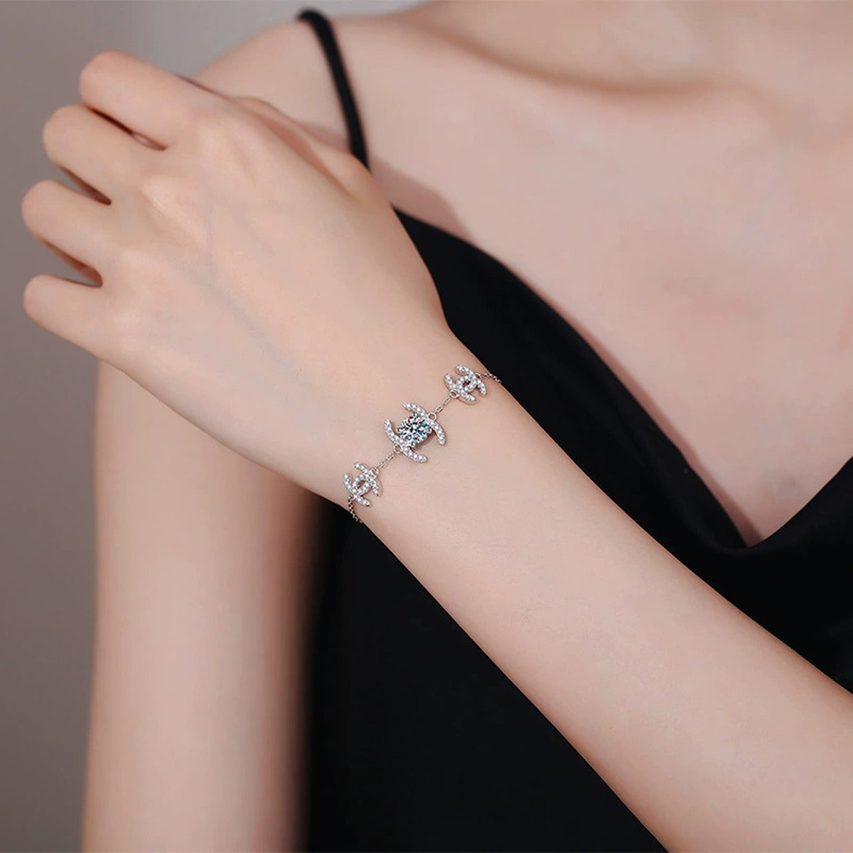 Butterfly Moissanite Chain Bracelet with CZ in White Gold-Plated S925 Sterling Silver worn on wrist model view showing scale and fit