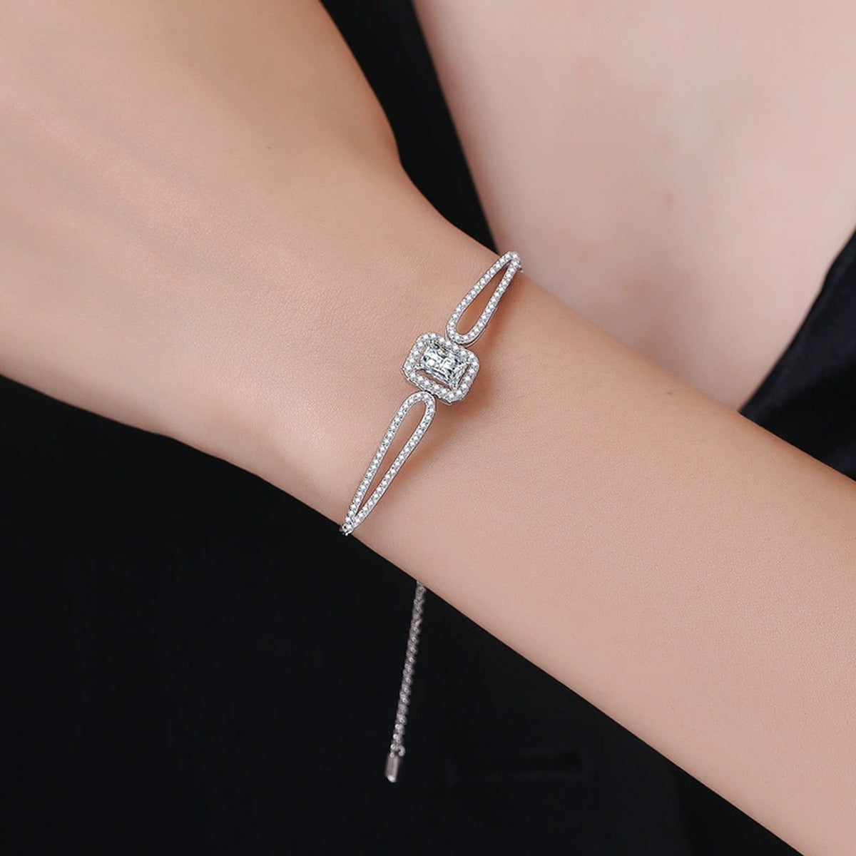 Pear Moissanite Adjustable Bangle Bracelet with CZ in White Gold-Plated S925 Sterling Silver worn on wrist model view showing scale and fit