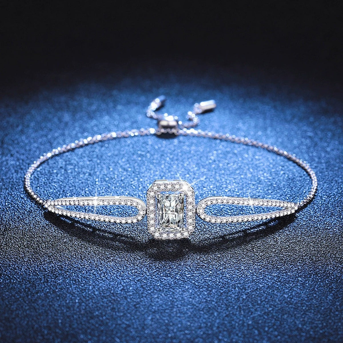 Pear Moissanite Adjustable Bangle Bracelet with CZ in White Gold-Plated S925 Sterling Silver blue display scene showing bracelet sparkle and chain detail