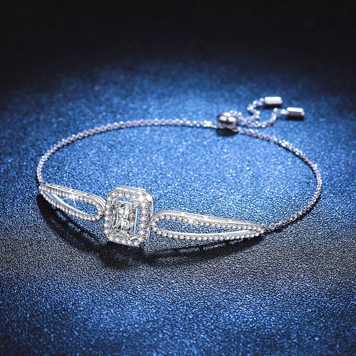 Pear Moissanite Adjustable Bangle Bracelet with CZ in White Gold-Plated S925 Sterling Silver blue display scene showing bracelet sparkle and chain detail