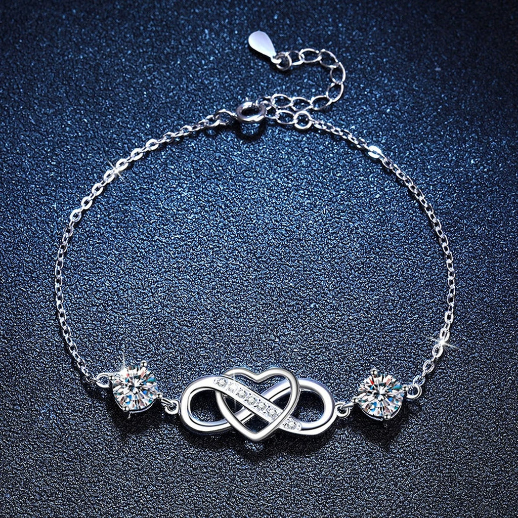Infinity Heart Moissanite Chain Bracelet with CZ in White Gold-Plated S925 Sterling Silver blue display scene showing bracelet sparkle and chain detail
