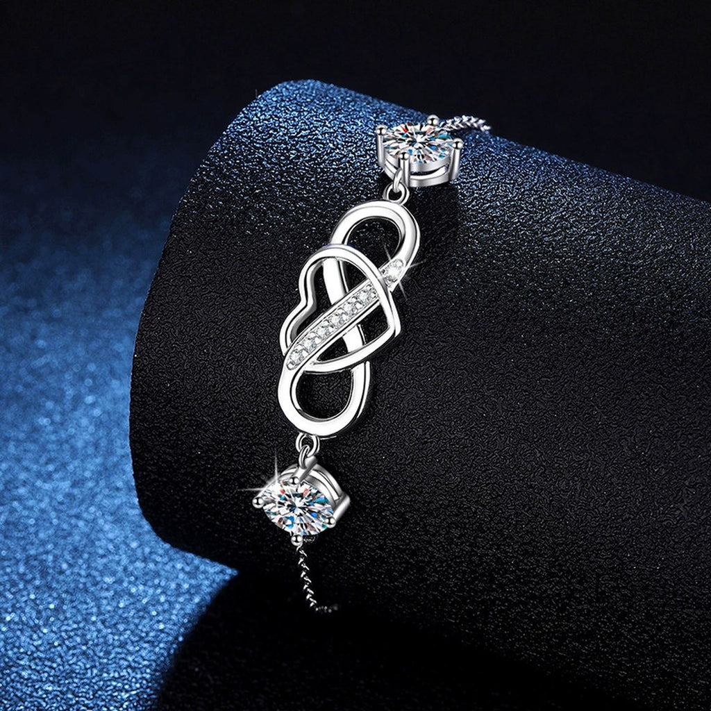 Infinity Heart Moissanite Chain Bracelet with CZ in White Gold-Plated S925 Sterling Silver blue display scene showing bracelet sparkle and chain detail