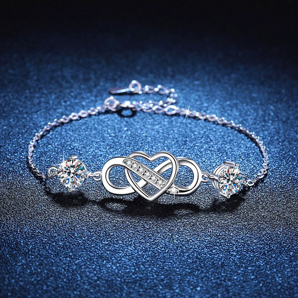 Infinity Heart Moissanite Chain Bracelet with CZ in White Gold-Plated S925 Sterling Silver blue display scene showing bracelet sparkle and chain detail