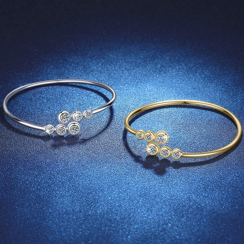 Three-Stone Moissanite Bangle Bracelet in Gold-Plated S925 Sterling Silver blue display scene showing bracelet sparkle and chain detail