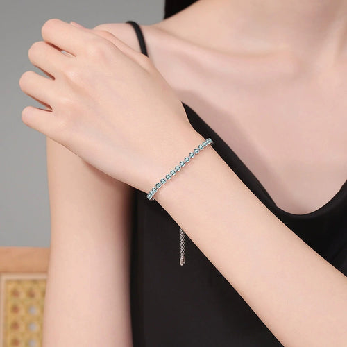 Aqua Moissanite Tennis Bracelet in White Gold-Plated S925 Sterling Silver worn on wrist model view showing scale and fit