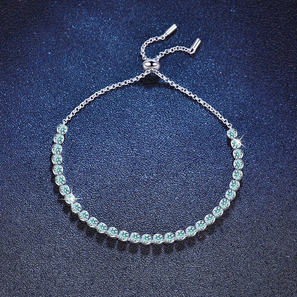 Aqua Moissanite Tennis Bracelet in White Gold-Plated S925 Sterling Silver blue display scene showing bracelet sparkle and chain detail