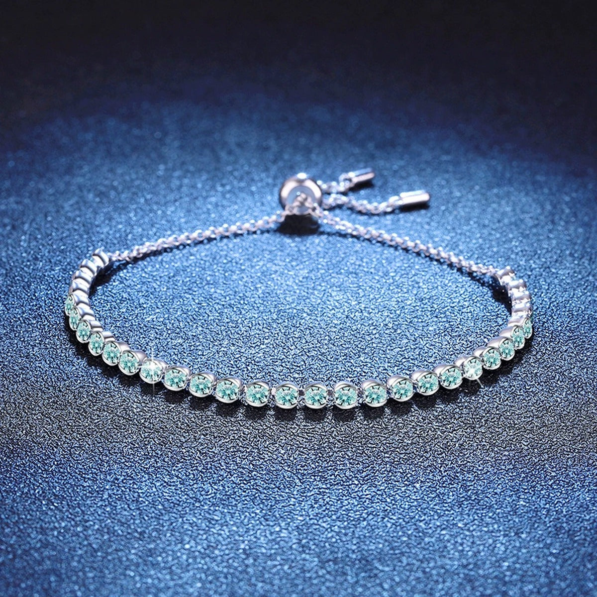 Aqua Moissanite Tennis Bracelet in White Gold-Plated S925 Sterling Silver blue display scene showing bracelet sparkle and chain detail