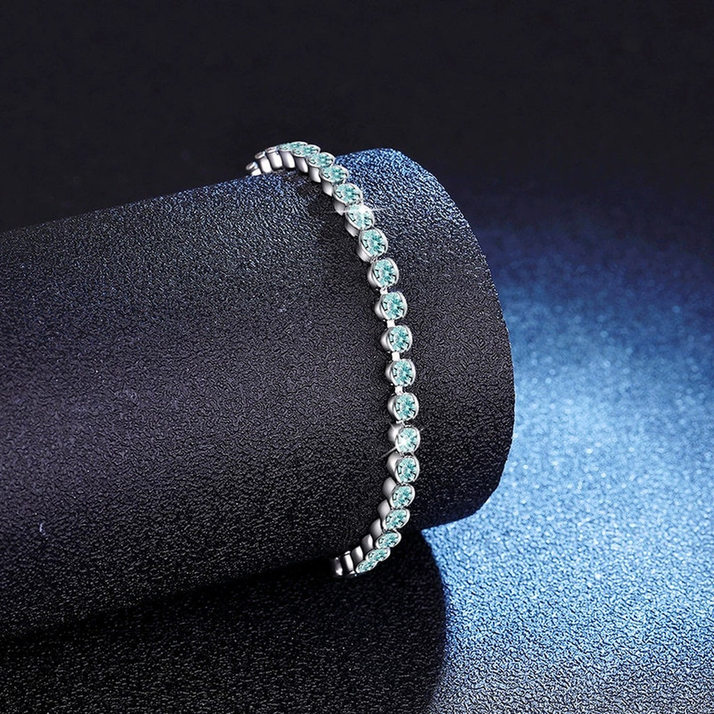 Aqua Moissanite Tennis Bracelet in White Gold-Plated S925 Sterling Silver blue display scene showing bracelet sparkle and chain detail