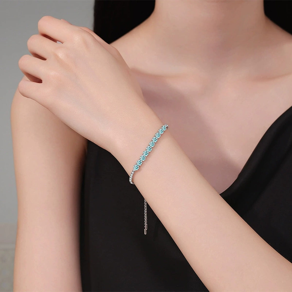 Aqua Moissanite Tennis Bracelet in White Gold-Plated S925 Sterling Silver worn on wrist model view showing scale and fit
