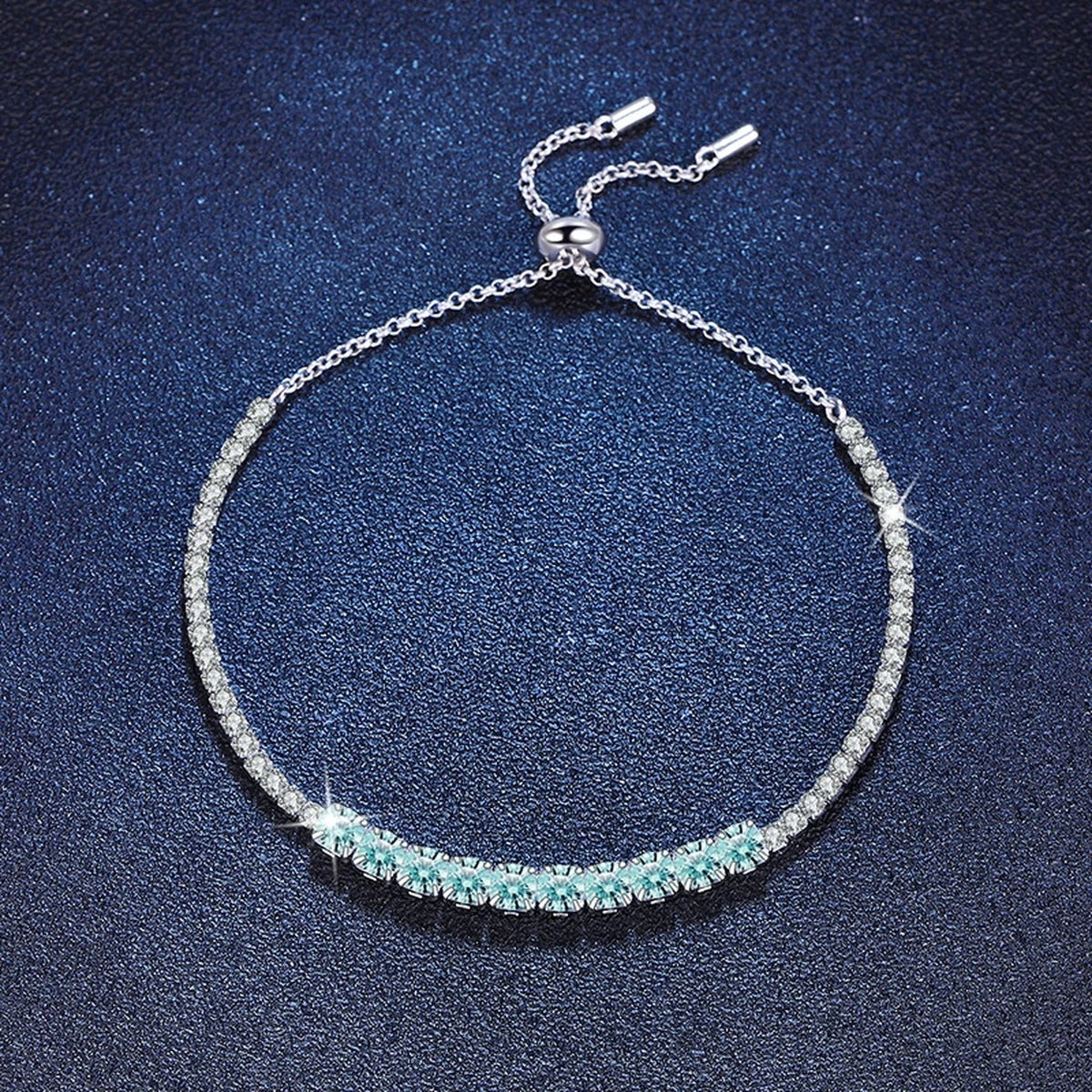 Aqua Moissanite Tennis Bracelet in White Gold-Plated S925 Sterling Silver blue display scene showing bracelet sparkle and chain detail