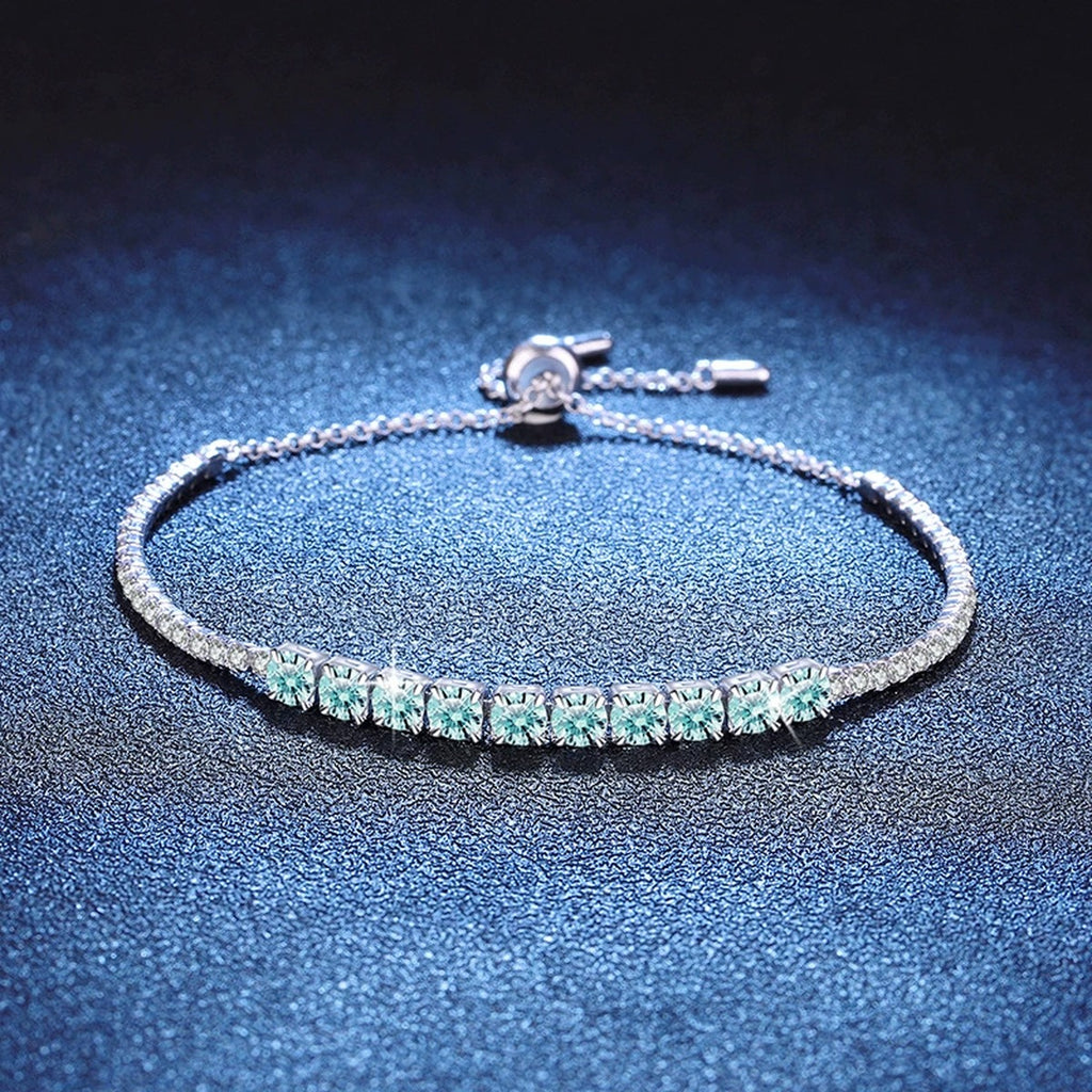 Aqua Moissanite Tennis Bracelet in White Gold-Plated S925 Sterling Silver blue display scene showing bracelet sparkle and chain detail