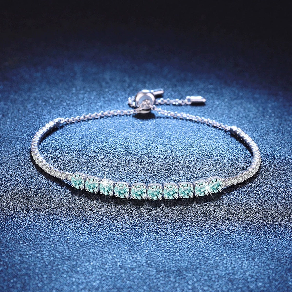 Aqua Moissanite Tennis Bracelet in White Gold-Plated S925 Sterling Silver blue display scene showing bracelet sparkle and chain detail