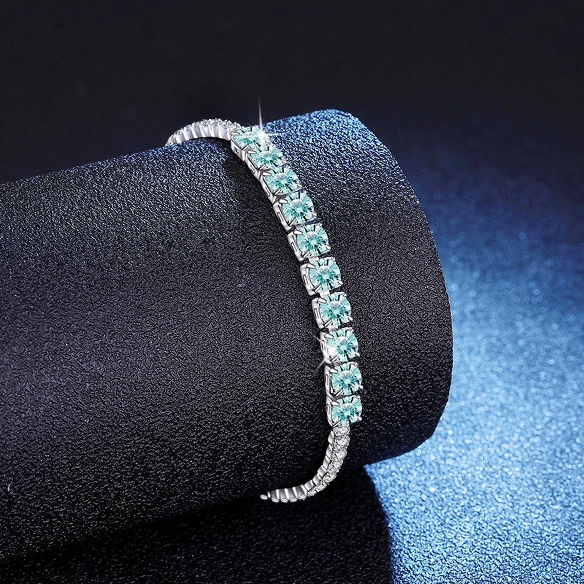 Aqua Moissanite Tennis Bracelet in White Gold-Plated S925 Sterling Silver blue display scene showing bracelet sparkle and chain detail
