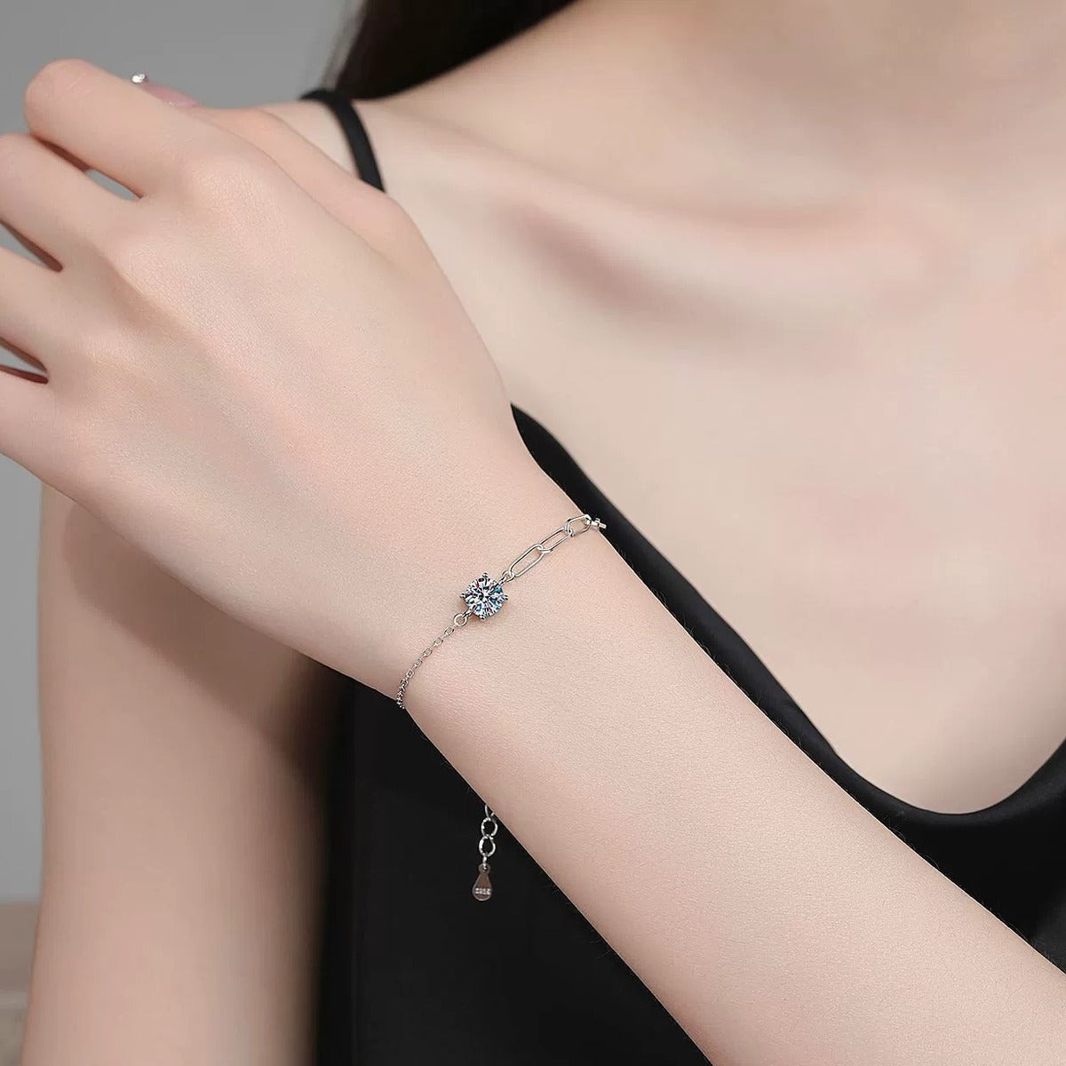 Round Moissanite Chain Bracelet in White Gold-Plated S925 Sterling Silver worn on wrist model view showing scale and fit