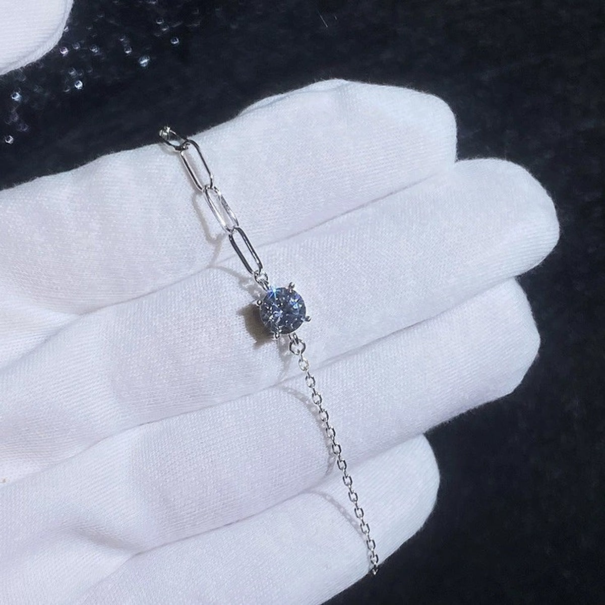 Round Moissanite Chain Bracelet in White Gold-Plated S925 Sterling Silver blue display scene showing bracelet sparkle and chain detail