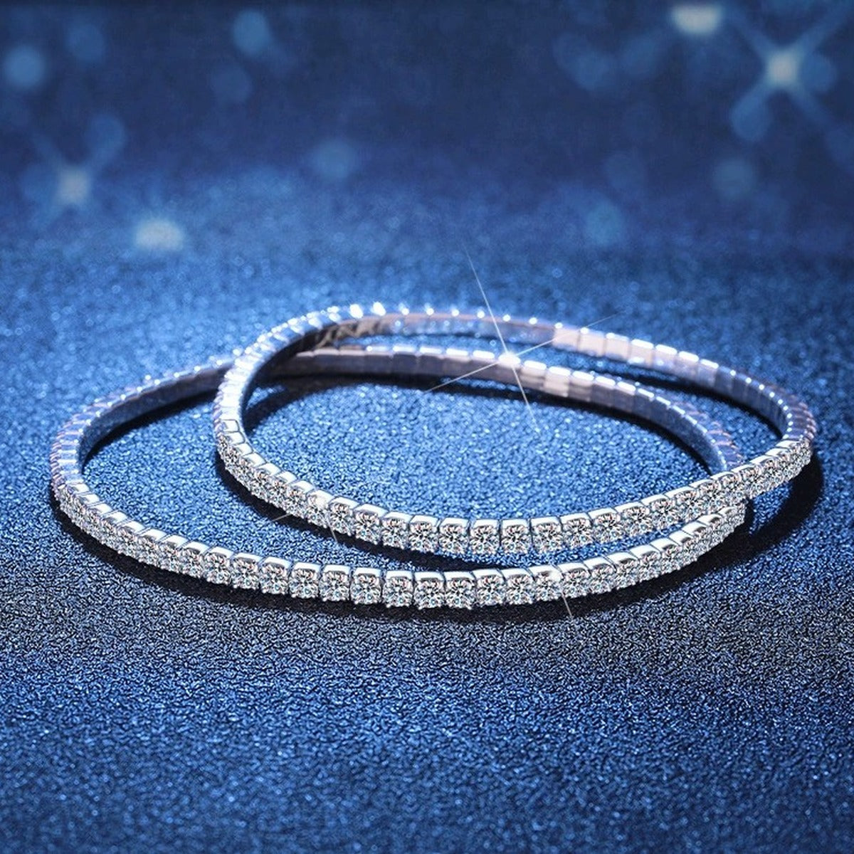 Moissanite Tennis Bangle Bracelet in White Gold-Plated S925 Sterling Silver blue display scene showing bracelet sparkle and chain detail