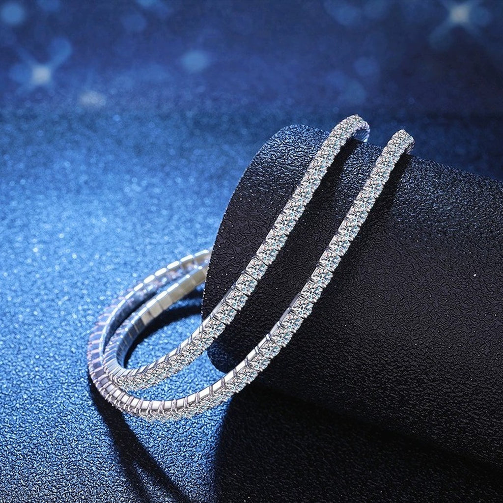 Moissanite Tennis Bangle Bracelet in White Gold-Plated S925 Sterling Silver blue display scene showing bracelet sparkle and chain detail