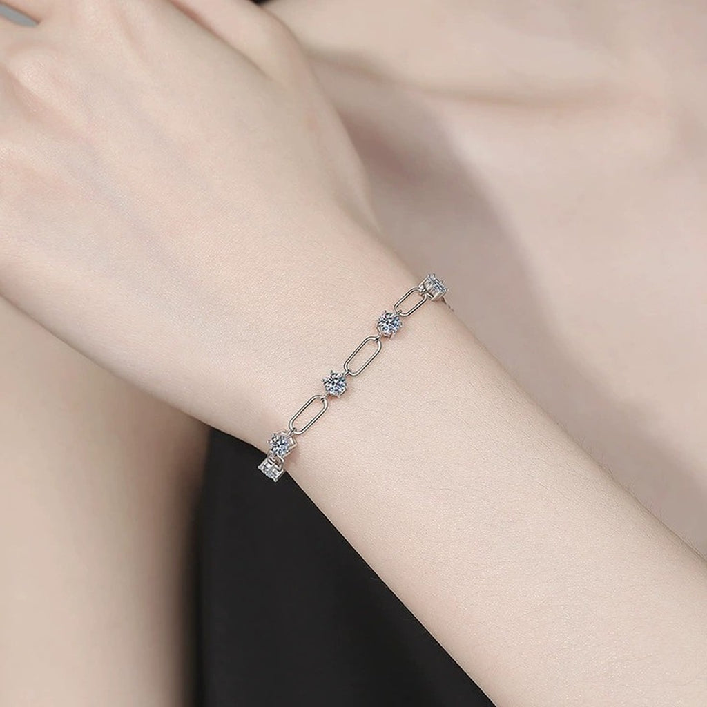 Three-Stone Moissanite Chain Bracelet in White Gold-Plated S925 Sterling Silver worn on wrist model view showing scale and fit