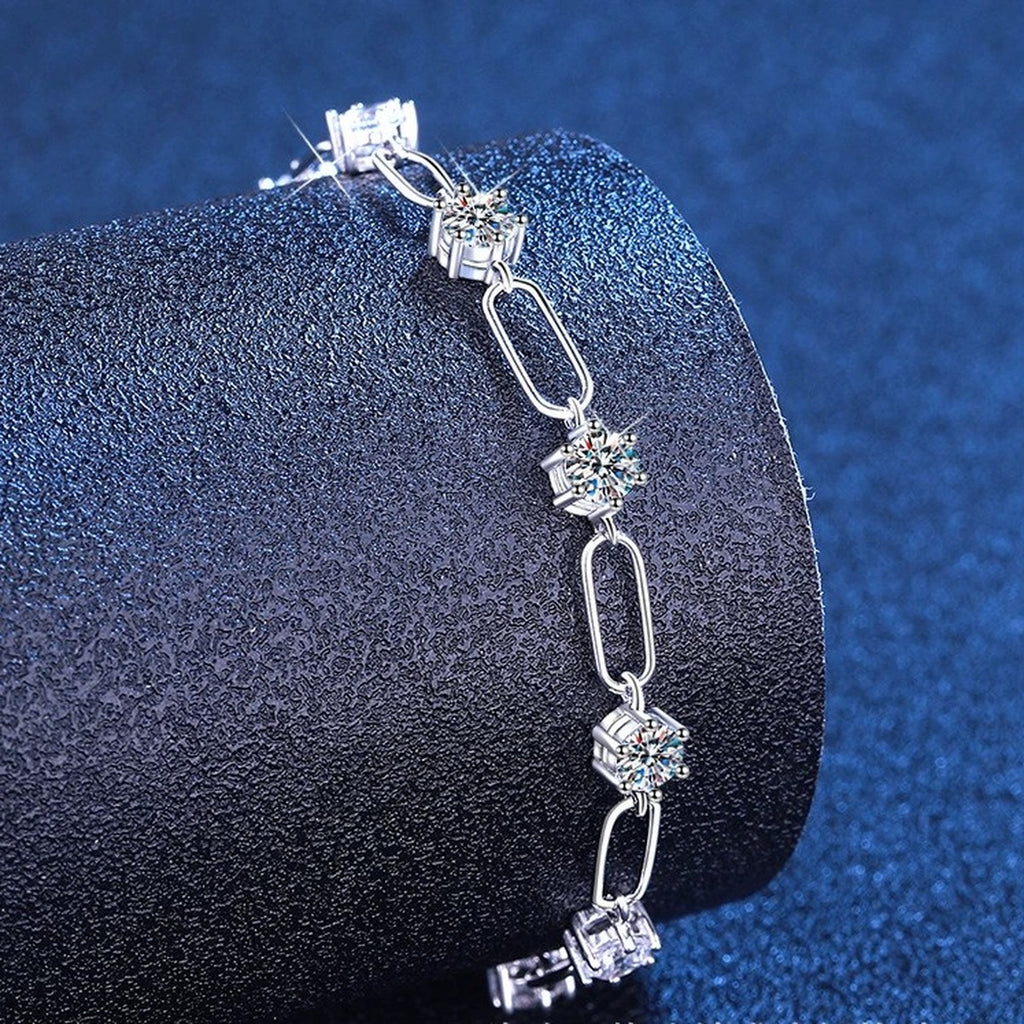 Three-Stone Moissanite Chain Bracelet in White Gold-Plated S925 Sterling Silver blue display scene showing bracelet sparkle and chain detail