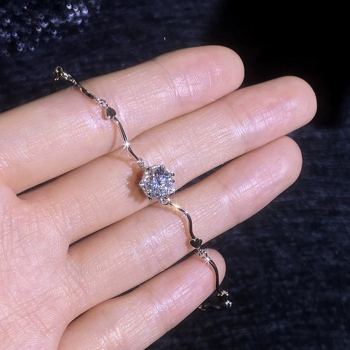 Round Moissanite Chain Bracelet in White Gold-Plated S925 Sterling Silver dark display close-up highlighting stone setting and metal finish