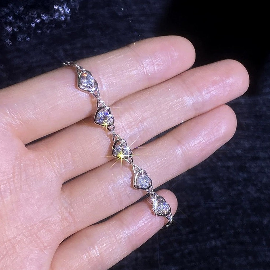 Heart Moissanite Station Bracelet hand-held close-up showing stone detail, width, and bracelet finish