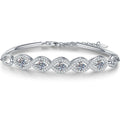 Oval Moissanite Bangle Bracelet with CZ white background product photo showing bracelet silhouette and moissanite setting