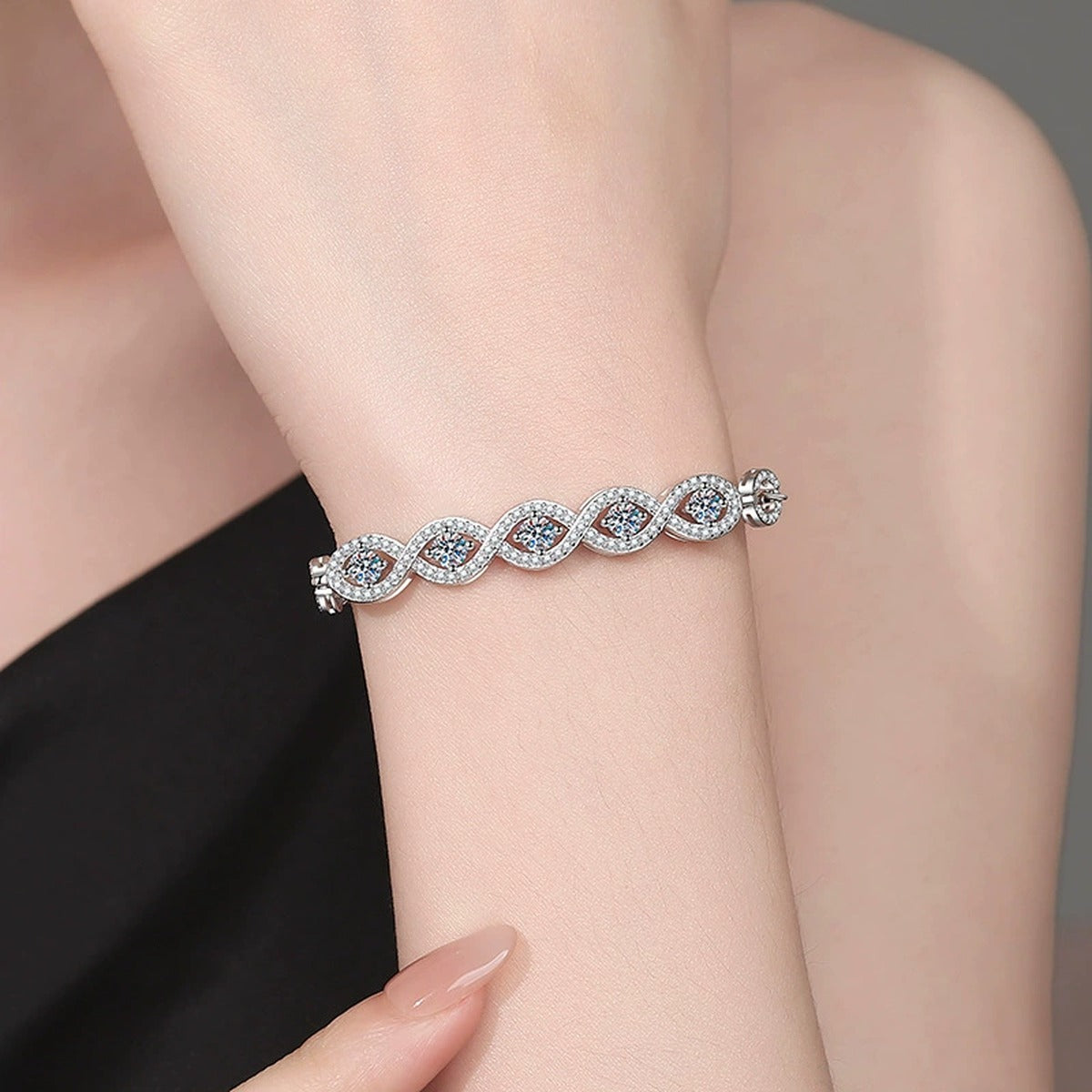 Oval Moissanite Bangle Bracelet with CZ worn on wrist model view showing bracelet scale and fit