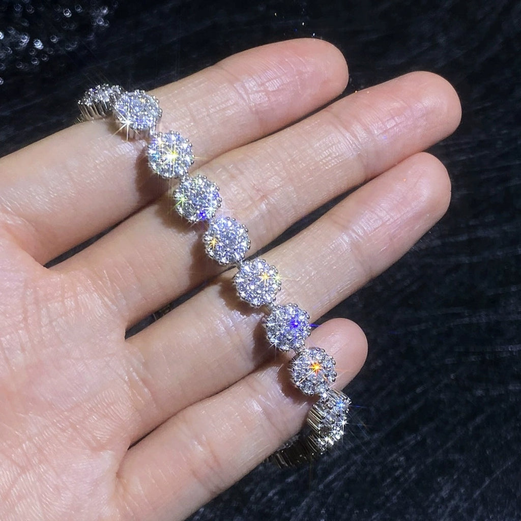 Round Moissanite Tennis Bracelet with CZ hand-held close-up showing stone detail, width, and bracelet finish