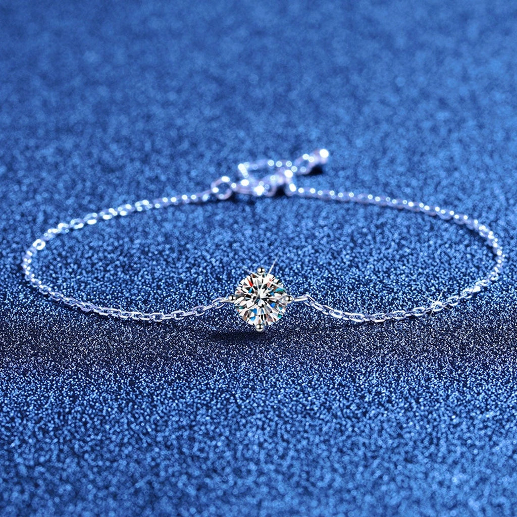 Round Moissanite Chain Bracelet styled on blue display background showing moissanite sparkle and chain detail