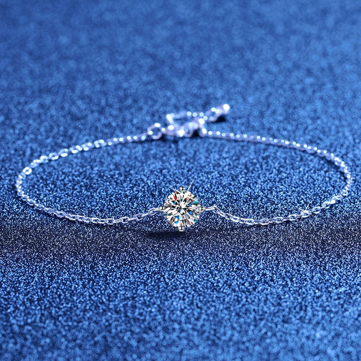 Round Moissanite Chain Bracelet styled on blue display background showing moissanite sparkle and chain detail
