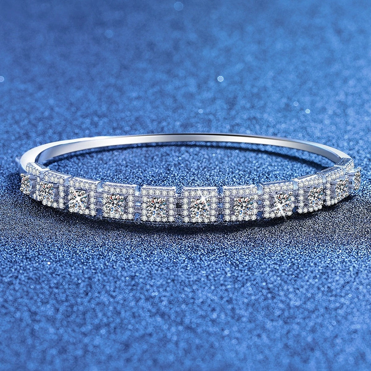 Three-Row Moissanite Bangle Bracelet styled on blue display background showing moissanite sparkle and chain detail