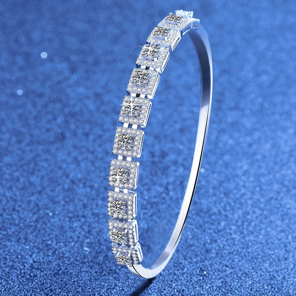 Three-Row Moissanite Bangle Bracelet styled on blue display background showing moissanite sparkle and chain detail
