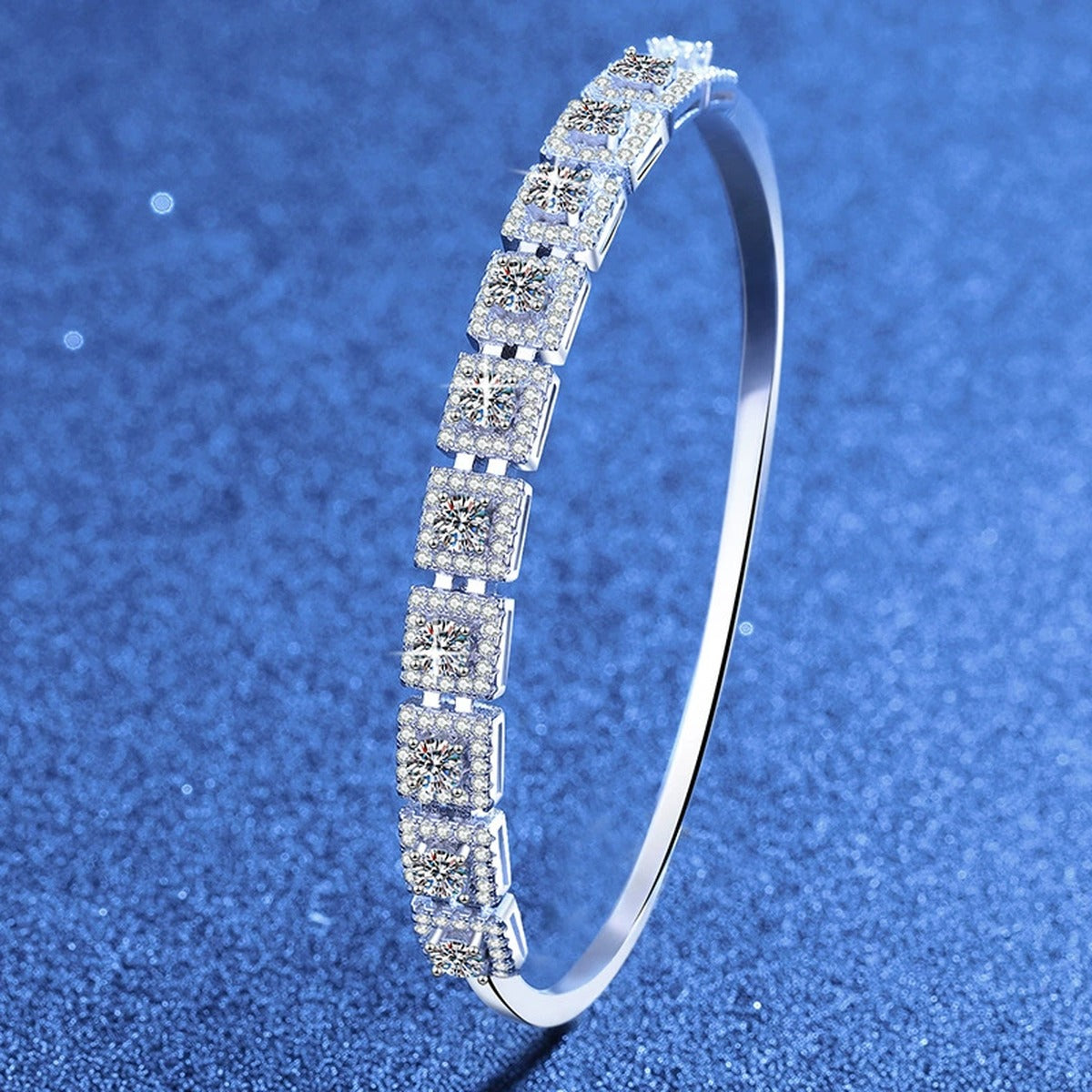 Three-Row Moissanite Bangle Bracelet styled on blue display background showing moissanite sparkle and chain detail